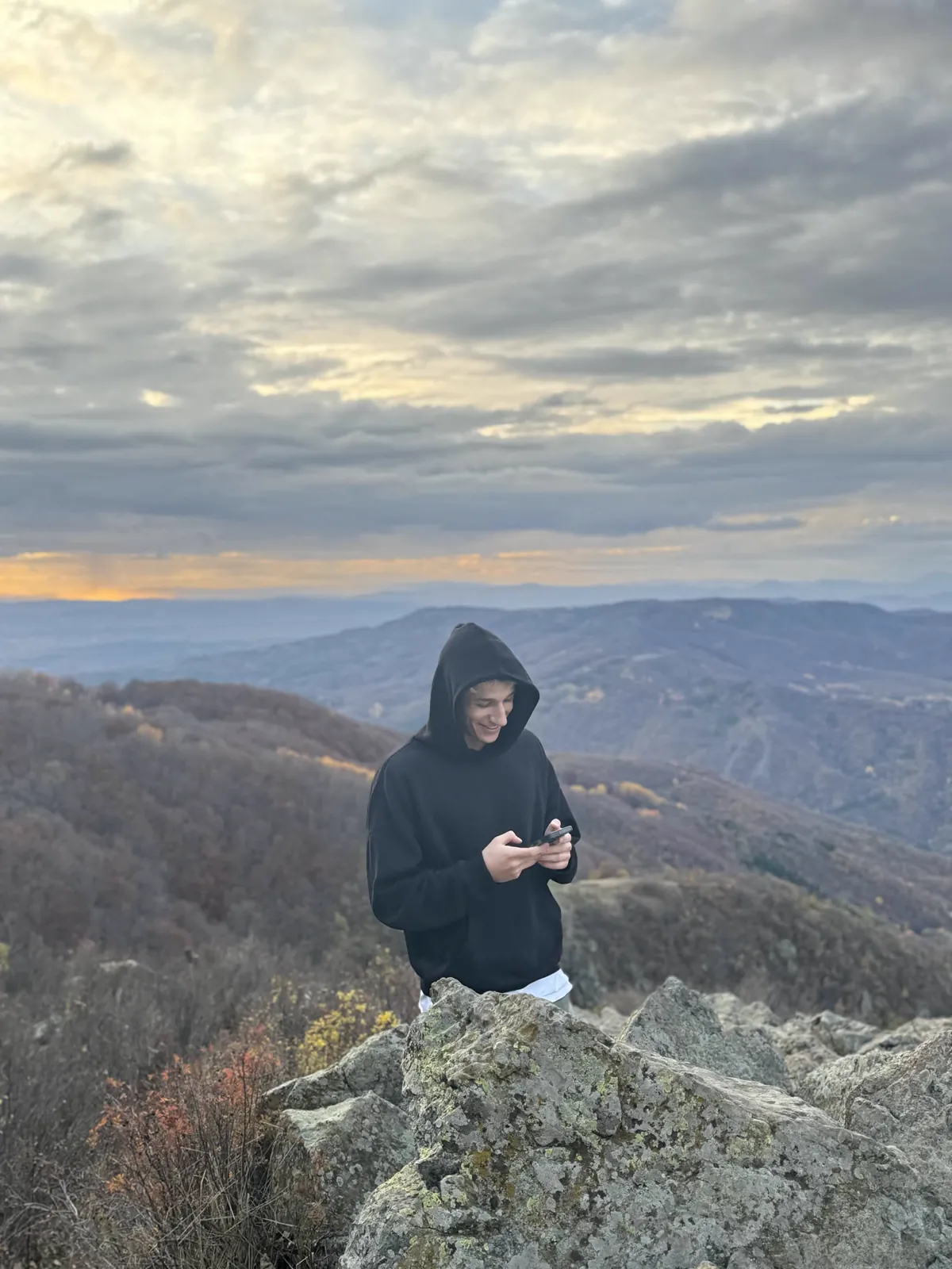 Emil on a mountain ridge at sunset
